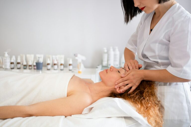 Relaxed young woman receiving spa treatment in beauty salon